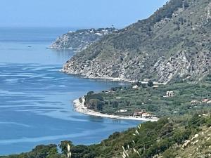 a view of a large body of water with mountains at Casa vacanza Amanda in Nicotera Marina +6 photos