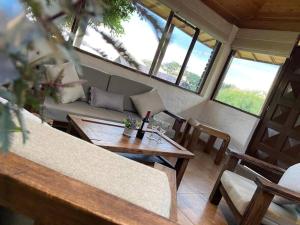 a living room with a couch and a table at La Arboleda, Refugio in Cogua