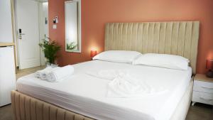 Postel nebo postele na pokoji v ubytování Hotel Luris