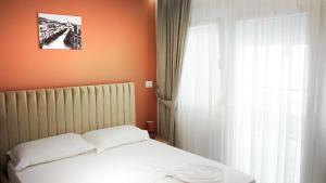 Postel nebo postele na pokoji v ubytování Hotel Luris