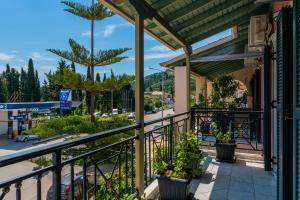 a balcony with a view of a street at G.R luxury apartment in Lefkada Town