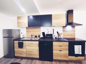 Kuchyň nebo kuchyňský kout v ubytování loft industriel L'Idaho