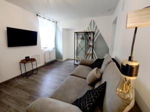 TV a/nebo společenská místnost v ubytování loft industriel L'Idaho