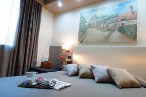 Postel nebo postele na pokoji v ubytování Holiday Rooms Antica Badia