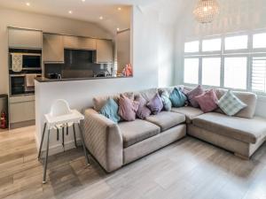 a living room with a couch with pillows on it at True North in Scarborough