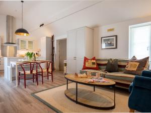 a living room with a couch and a table at The Fold in Charlbury