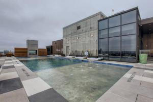 a swimming pool on the roof of a building at 21st FL 2BD Condo-Rainey St-Best views in Austin