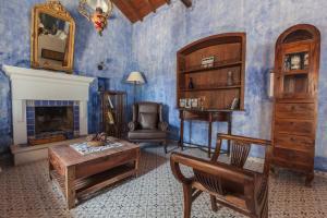 a living room filled with furniture and a fireplace at Big Blue Pelion in Pilion