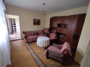 a living room with a couch and a table at Sremac in Kupinovo