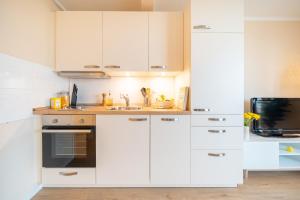 Kuchyň nebo kuchyňský kout v ubytování CNSc316 - 2-Raum Appartement