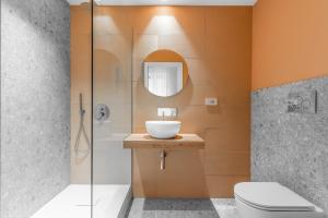 a bathroom with a sink and a shower at Casa da Suite Sarpi in Milan