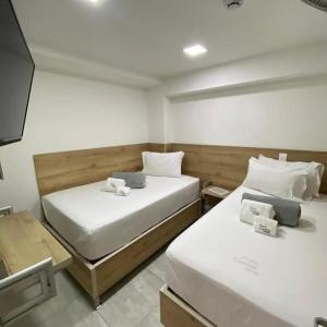 En eller flere senge i et værelse på Hotel Park Caribe