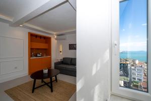 a living room with a couch and a table at Juno Hotel Taksim in Istanbul