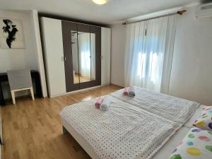 Postel nebo postele na pokoji v ubytování Apartment Deni