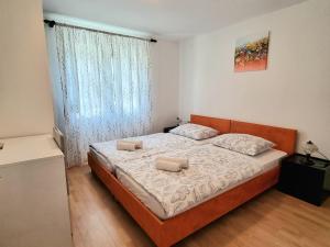 Postel nebo postele na pokoji v ubytování Apartment Deni + 18 fotografií