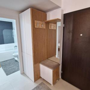 a small bathroom with a toilet and a sink at Comfort cosmopolis in Ştefăneştii de Jos
