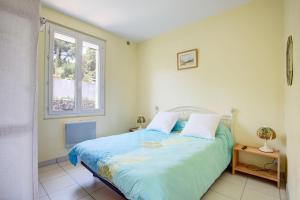 Ένα ή περισσότερα κρεβάτια σε δωμάτιο στο Mirande 2 - Appt avec vue mer proche plage