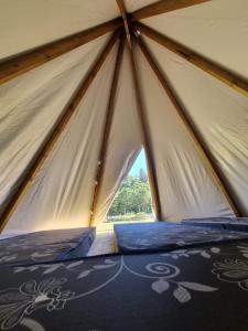 a large tent with a window in it at FamilyCamp hospedagem perto do Magic City in Suzano