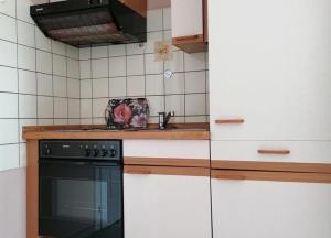 Kuchyň nebo kuchyňský kout v ubytování Haus Südwind Herzmuschel - klein aber fein