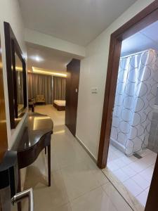 a bathroom with a sink and a mirror at Clifton International Hotel in Fujairah