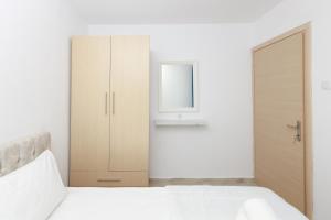 Postel nebo postele na pokoji v ubytování Vergia Apartment 1