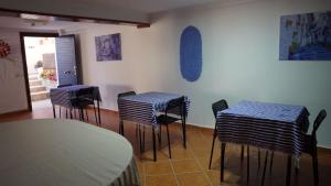 a group of stools in a room with blue and white stripes at riad casa bahia asilah in Asilah