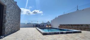 a swimming pool on the roof of a house at 4 FAMILY HOME WITH POOL, Fuerteventura-Gran Tarajal in Juan Gopar +21 photos