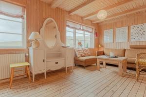 a living room with a couch and a table at Stunning Sea View - 3BR - Beach - Scenic Village in Leynar