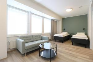 Postel nebo postele na pokoji v ubytování Forenom Aparthotel Helsinki Herttoniemi