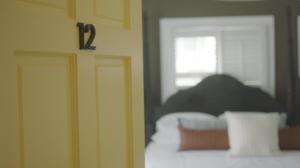 a close up of a bedroom with a bed at The Ellery Hotel in Provincetown