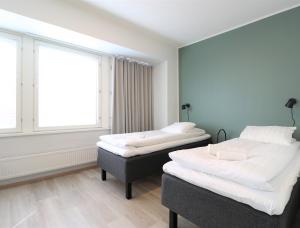 Postel nebo postele na pokoji v ubytování Forenom Aparthotel Helsinki Herttoniemi