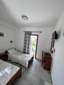Ένα ή περισσότερα κρεβάτια σε δωμάτιο στο Summer Time