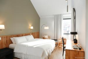 Postel nebo postele na pokoji v ubytování Kaulem Hotel Boutique