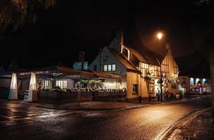 a town at night with a building and a street at 1 Bed Loft - Sleeps 2 - Parking - Wifi in Newport