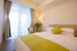 Ένα ή περισσότερα κρεβάτια σε δωμάτιο στο NEW OPEN City View Suite in Minami-Azabu