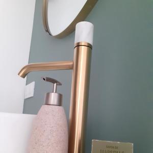 a close up of a lamp and a soap dispenser at L escapade in Saint-Siffret