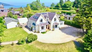 an aerial view of a house with a large yard at Allandale House in Brodick