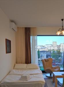 Una cama o camas en una habitación de Belgrade Waterfront Nabucco