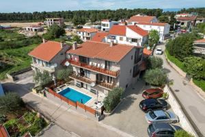 an aerial view of a house with a pool at Pool Apartments Julia in Zadar