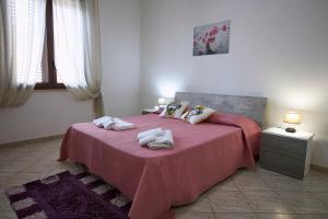 Postel nebo postele na pokoji v ubytování Sweet Home Rosa