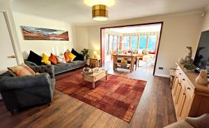 a living room with a couch and a table at Yewtree House in Penrith