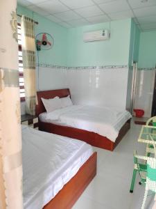 Giường trong phòng chung tại Thinh Thien Motel