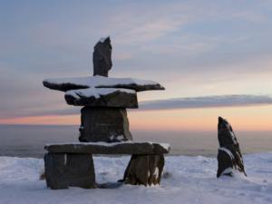 a statue of a fountain in the snow at Bear Country Inn in Churchill