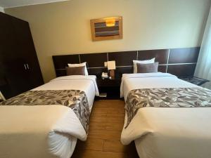 Postel nebo postele na pokoji v ubytování Hotel El Tambo 2