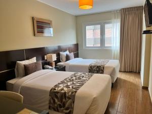 Postel nebo postele na pokoji v ubytování Hotel El Tambo 2