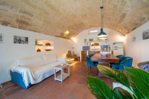 a living room with a couch and a table at Palazzo De Mori in Otranto
