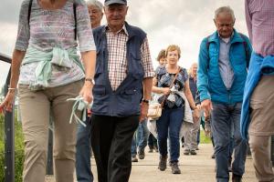 a group of people walking down a sidewalk at Time to relax in Gennep