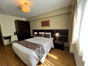 Postel nebo postele na pokoji v ubytování Hotel El Tambo 2