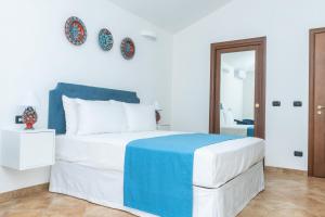 Postel nebo postele na pokoji v ubytování Relais Ruggiero