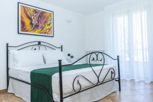 Postel nebo postele na pokoji v ubytování Relais Ruggiero